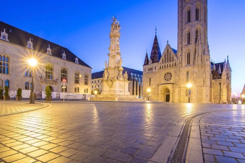 Old historic fortress and church at sunrise. City panorama at dusk. View of the Danube Fishermen's