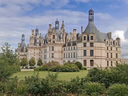 Chateau de Chambord a majestic medieval castle with green gardens. Beautiful palace in the region