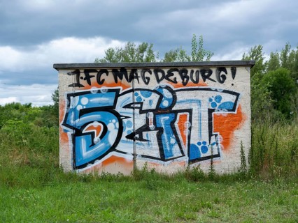 Graffiti 1. FC Magdeburg since 1965 on a wall at Jersleber See. In the European Cup, 1. FC