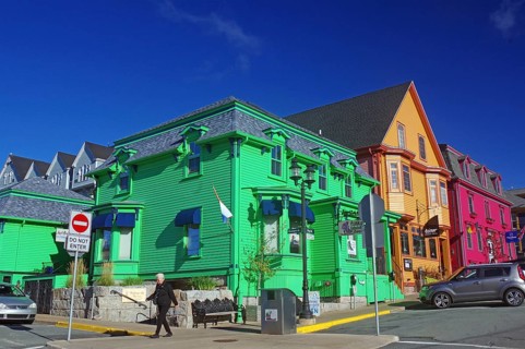 Colourful historic buildings on a city street under a clear blue sky, Lunenburg, Nova Scotia,