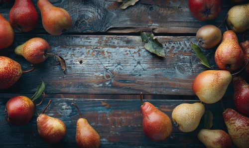 Top view of assorted pears on a rustic wooden table AI generated