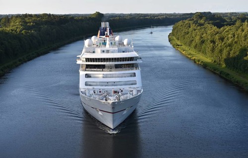 Cruise ship Europa 2 sailing in the evening light in the Kiel Canal, Kiel Canal,