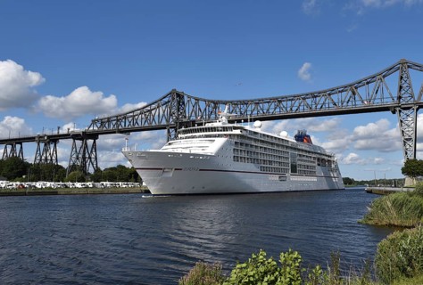 Cruise ship Europa 2 passes through the railway bridge in the Kiel Canal in Rendsburg, Kiel Canal,