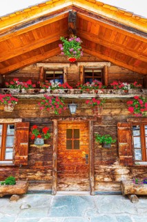 Old wooden house with floral decorations, historic village centre, Grimentz, Val d'Anniviers,