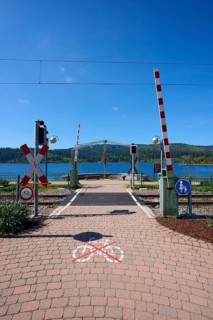 Railway crossing at Schluchsee and blue sky, embedded in a mountain landscape, Schluchsee, Black