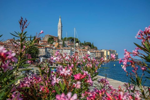 Old historic dreamy town on a beautiful island. Panorama of a romantic tourist town on a coast.