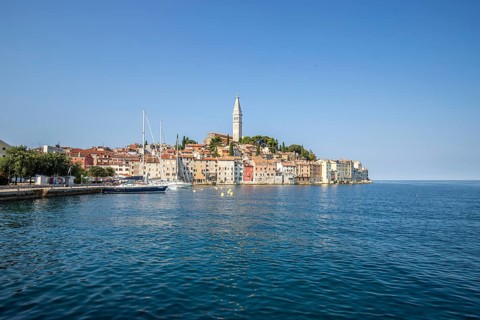 Old historic dreamy town on a beautiful island. Panorama of a romantic tourist town on a coast.