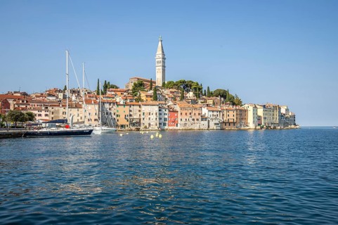 Old historic dreamy town on a beautiful island. Panorama of a romantic tourist town on a coast.