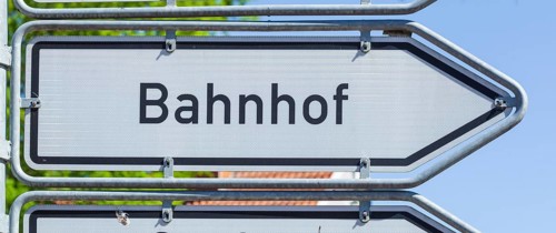 Road sign Signpost to railway station, Germany, Europe