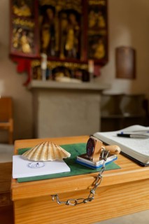 Pilgrim's stamp and pilgrim's guest book in the Wolfgangskirche, rose garden-Tullau, Tullau,