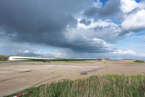 Blade of a wind turbine parked near the planned installation site, preparation for the construction