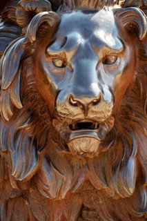 Head of a lion statue made from cast iron, the monument is located in Lubeck Germany in front of