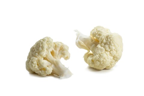 Two pieces or florets of cauliflower, ingredient for healthy cooking with vegetables, isolated on a