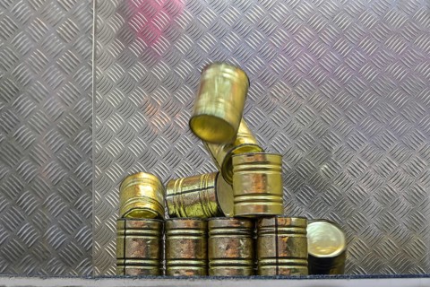 Falling tin can pyramid hit by a ball, throwing game at a carnival funfair or Christmas market,