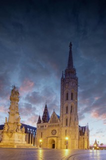 Old historic fortress and church at sunrise. City panorama at dusk. View of the Danube Fishermen's