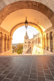 Old historic fortress and church at sunrise. City panorama at dusk. View of the Danube Fishermen's