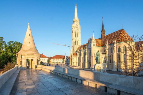 Old historic fortress and church at sunrise. City panorama at dusk. View of the Danube Fishermen's
