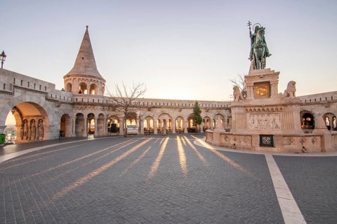 Old historic fortress and church at sunrise. City panorama at dusk. View of the Danube Fishermen's