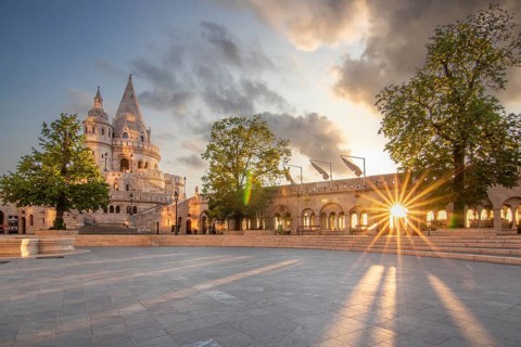 Old historic fortress and church at sunrise. City panorama at dusk. View of the Danube Fishermen's