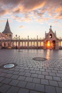 Old historic fortress and church at sunrise. City panorama at dusk. View of the Danube Fishermen's