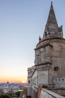 Old historic fortress and church at sunrise. City panorama at dusk. View of the Danube Fishermen's