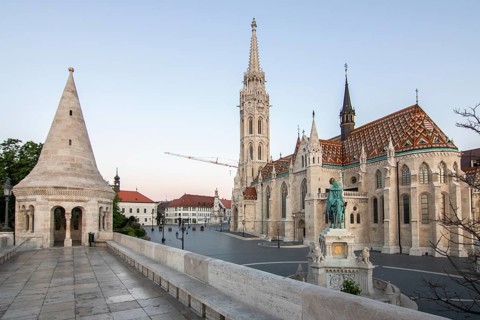 Old historic fortress and church at sunrise. City panorama at dusk. View of the Danube Fishermen's