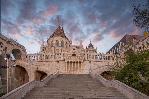 Old historic fortress and church at sunrise. City panorama at dusk. View of the Danube Fishermen's