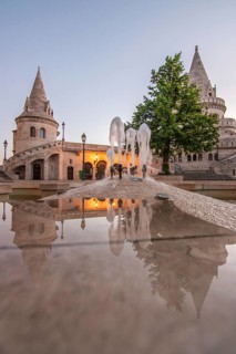 Old historic fortress and church at sunrise. City panorama at dusk. View of the Danube Fishermen's
