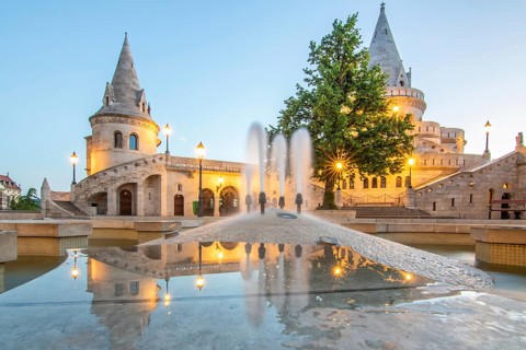 Old historic fortress and church at sunrise. City panorama at dusk. View of the Danube Fishermen's