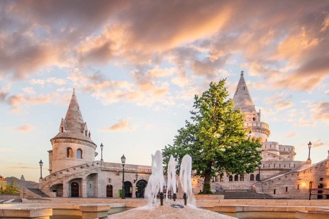 Old historic fortress and church at sunrise. City panorama at dusk. View of the Danube Fishermen's
