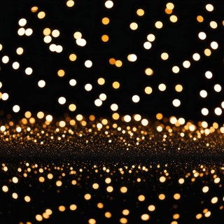 Abstract image of warm-colored lights reflecting to create a bokeh effect with a glowing pattern