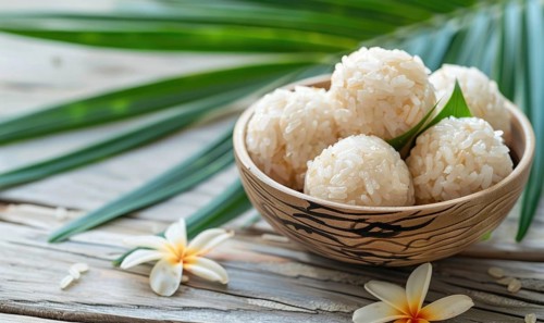 Thai coconut rice dumplings on a light wooden background AI generated