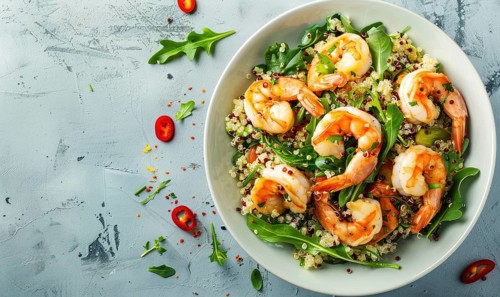 Shrimp and quinoa salad with citrus dressing on a light blue background AI generated