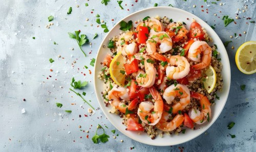 Shrimp and quinoa salad with citrus dressing on a light blue background AI generated