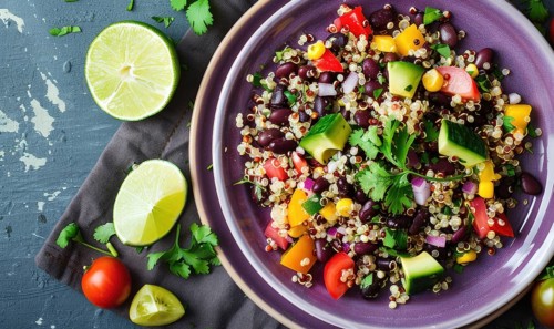 Quinoa and black bean salad with lime on a pastel purple plate AI generated