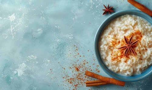 Puerto Rican arroz con dulce with cinnamon on a light blue background AI generated