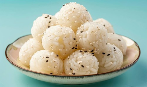 Korean steamed rice cakes (tteok) on a light blue background AI generated