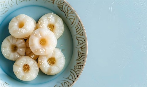 Korean steamed rice cakes (tteok) on a light blue background AI generated