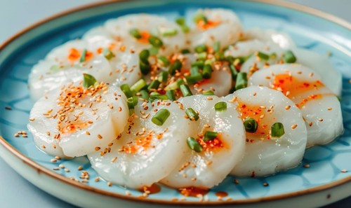 Korean steamed rice cakes (tteok) on a light blue background AI generated
