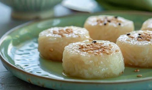 Korean honey rice cakes (yakgwa) on a pastel green plate AI generated
