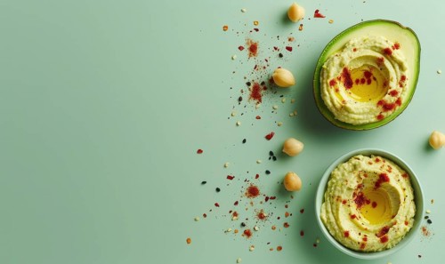 Avocado and hummus dip on a light green background AI generated