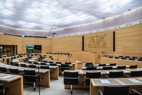 State parliament of Baden-Württemberg, assembly hall with state coat of arms. The seats of the