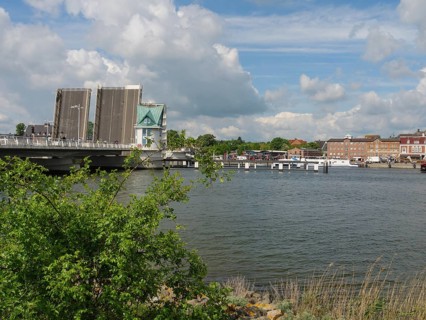 Open bridge over water in city scenery with clouds, Kappeln, SChleswig-Holstein, Germany, Europe