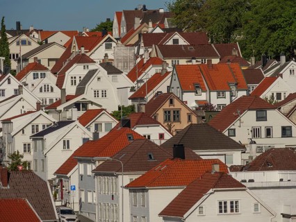 A neighbourhood with numerous houses and red tiled roofs, built close together, Stavanger, Norway,