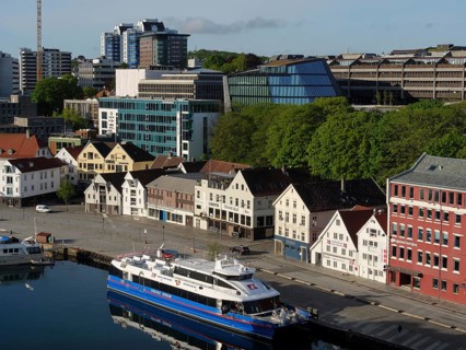 A cityscape with a harbour, modern buildings and boats under a clear sky, Stavanger, Norway, Europe