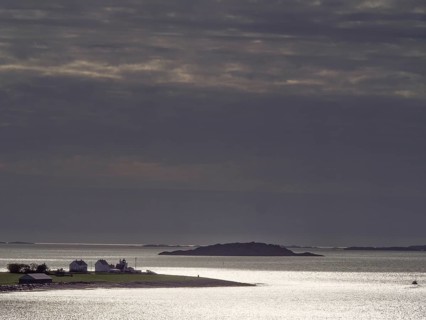 Twilight over a tranquil coastal landscape with silhouetted islands, Stavanger, Norway, Europe