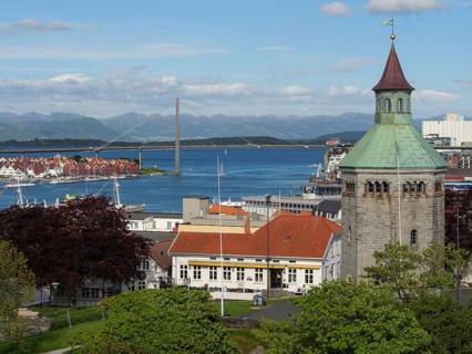 City view with church tower in the foreground, a bridge in the background and the sea, Stavanger,