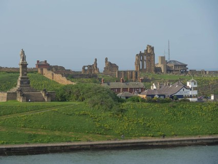 Landscape with historical ruins and a monument on a green hill, Newcastle, England, Great Britain