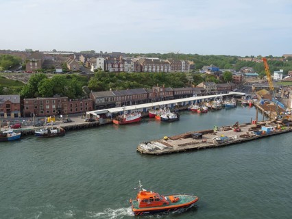 Harbour view with numerous boats and buildings along the coast, Newcastle, England, Great Britain