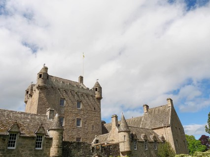 Large historic castle with towers and stone walls under a cloudy sky, inverness, Scotland, United